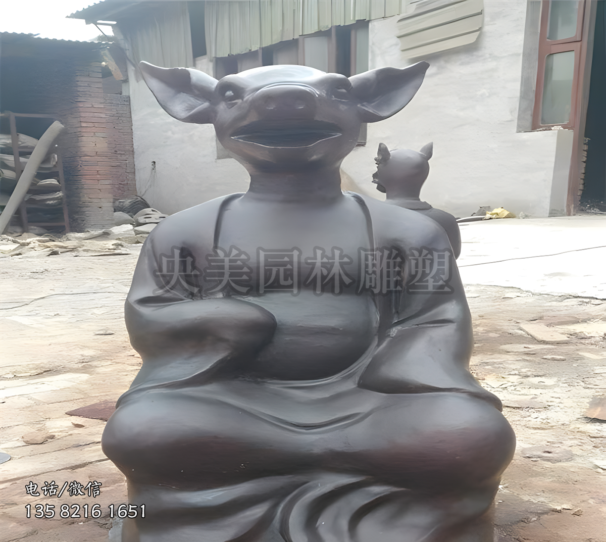 坐姿兽首人身亥猪铜雕塑